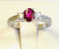 14K White Gold; .60 Ct Oval Ruby; .25 Ct.tw Round Diamonds