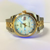 Picture of the actual white dial Datejust 16233 illuminated with black light
